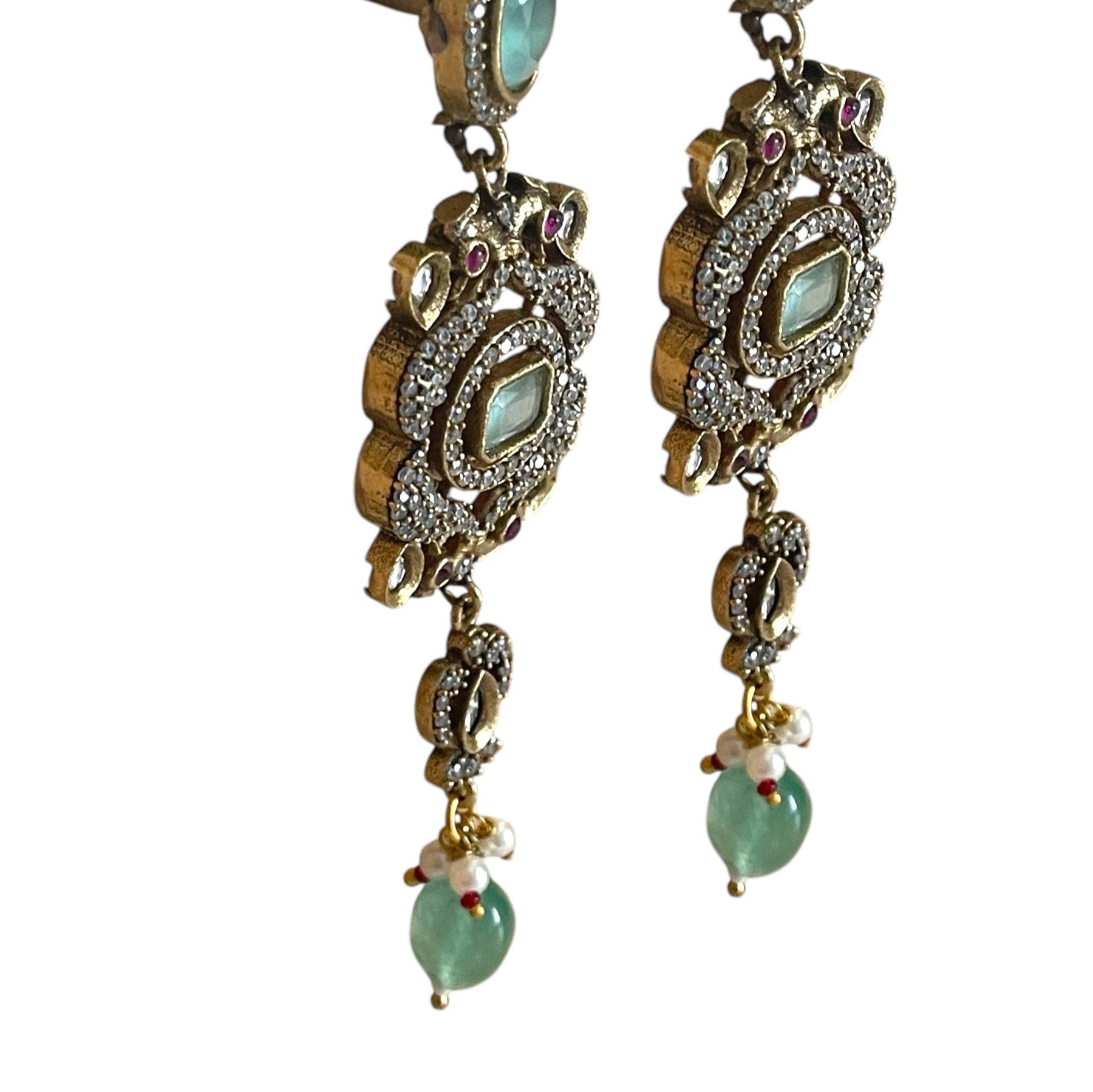The graceful drop bead adds movement and fluidity, embodying Annetta’s daring spirit and acrobatic elegance. The green jade symbolizes vitality and renewal, while the luxurious gold adds timeless sophistication. Inspired by Annetta’s extraordinary talents and captivating allure, these earrings capture the perfect balance of romantic artistry, feminine strength, and Parisian glamour.