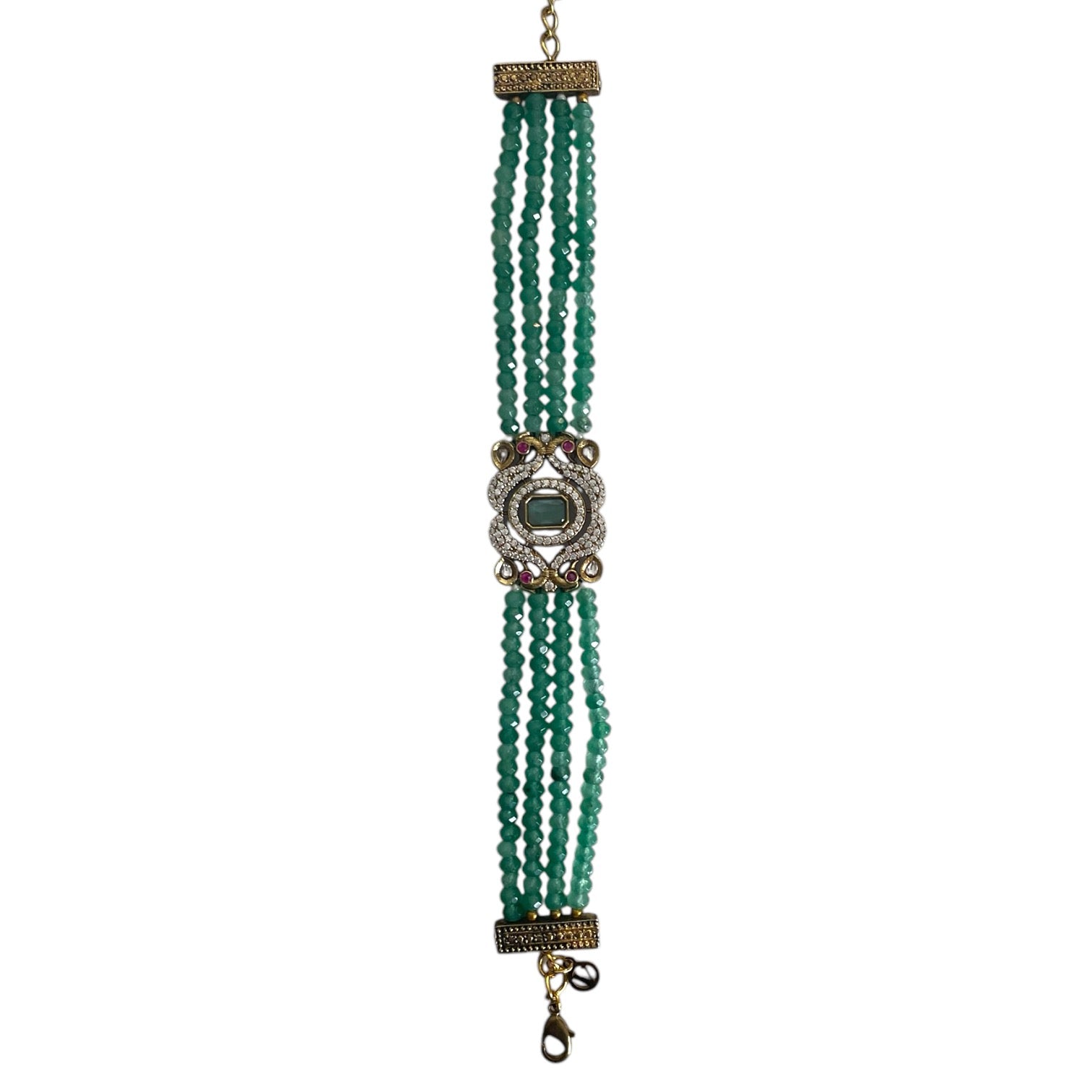 The Giovanna Bracelet is a luxurious tribute to Edith Piaf, named after her middle name, Giovanna. Handcrafted with four strands of jade beads on each side, this elegant bracelet features a rectangular center adorned with vibrant red, green, and white stones—each chosen for their symbolic meaning and energy.