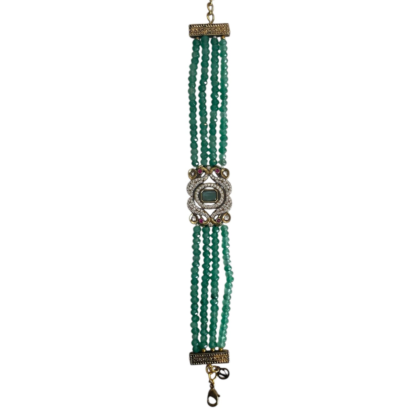 The Giovanna Bracelet is a luxurious tribute to Edith Piaf, named after her middle name, Giovanna. Handcrafted with four strands of jade beads on each side, this elegant bracelet features a rectangular center adorned with vibrant red, green, and white stones—each chosen for their symbolic meaning and energy.