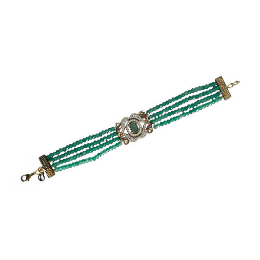 The Giovanna Bracelet is a luxurious tribute to Edith Piaf, named after her middle name, Giovanna. Handcrafted with four strands of jade beads on each side, this elegant bracelet features a rectangular center adorned with vibrant red, green, and white stones—each chosen for their symbolic meaning and energy.