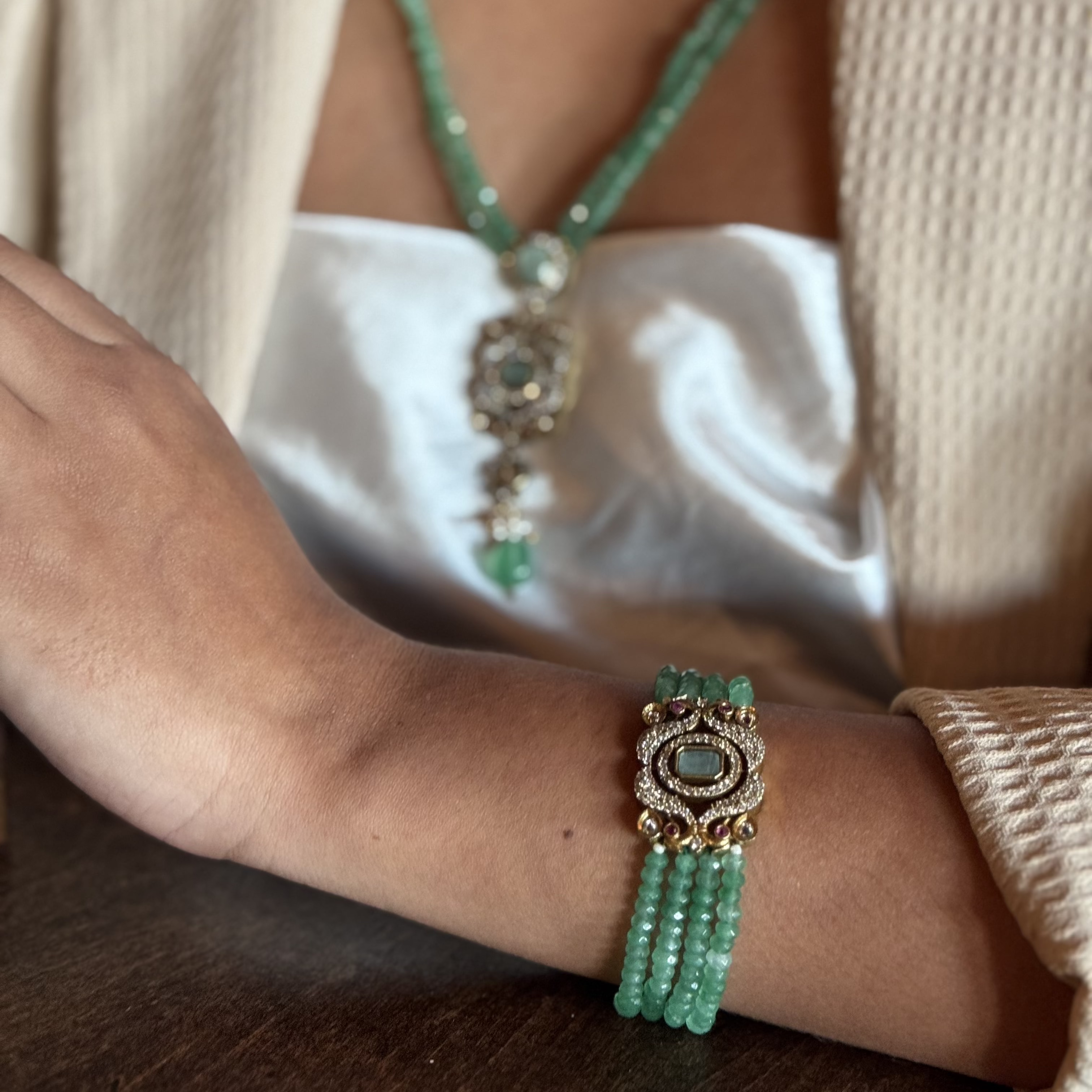 The Giovanna Bracelet is a luxurious tribute to Edith Piaf, named after her middle name, Giovanna. Handcrafted with four strands of jade beads on each side, this elegant bracelet features a rectangular center adorned with vibrant red, green, and white stones—each chosen for their symbolic meaning and energy.