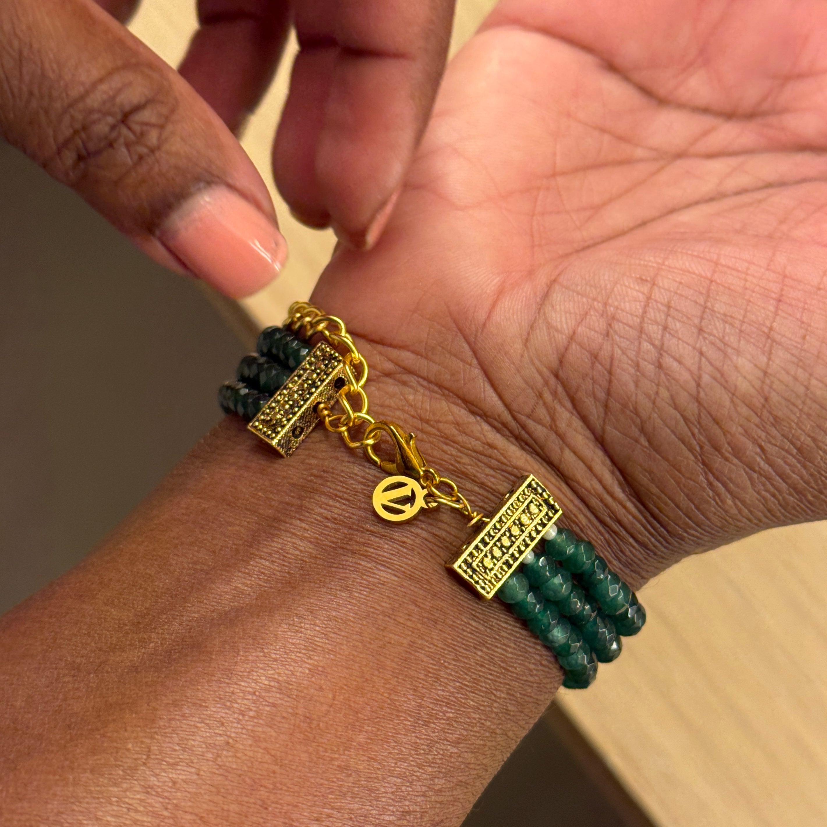 Introducing the Rita Bracelet, a stunning fusion of avant-garde elegance and Parisian flair. Inspired by the bold, rebellious spirit of the iconic French duo Les Rita Mitsouko, this bracelet features luminous jade beads and sparkling Kundan stones in a captivating green and gold palette with a hint of red. Designed to evoke the graceful, powerful movement of wings, it captures the essence of freedom, creativity, and unforgettable style.