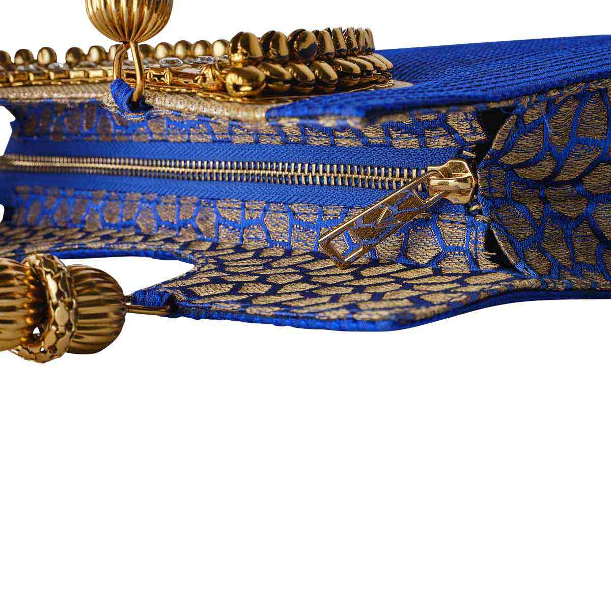 Suriya Mini tote blue and gold with ornate handles. As seen on ramp at NYFW 2021 and editorials. Zip to keep everything safe and avoid spill.