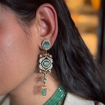 The graceful drop bead adds movement and fluidity, embodying Annetta’s daring spirit and acrobatic elegance. The green jade symbolizes vitality and renewal, while the luxurious gold adds timeless sophistication. Inspired by Annetta’s extraordinary talents and captivating allure, these earrings capture the perfect balance of romantic artistry, feminine strength, and Parisian glamour.