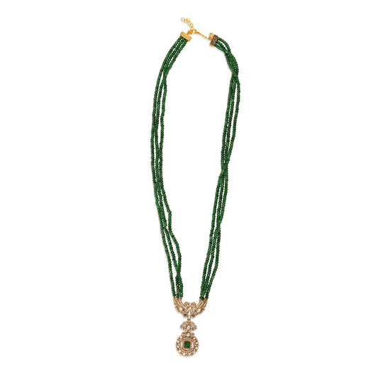 Green beaded necklace with a gold clasp on a white background