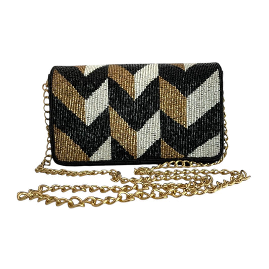 A luxurious velvet pouch with a geometric pattern of black, white, and gold beads, featuring a gold chain.