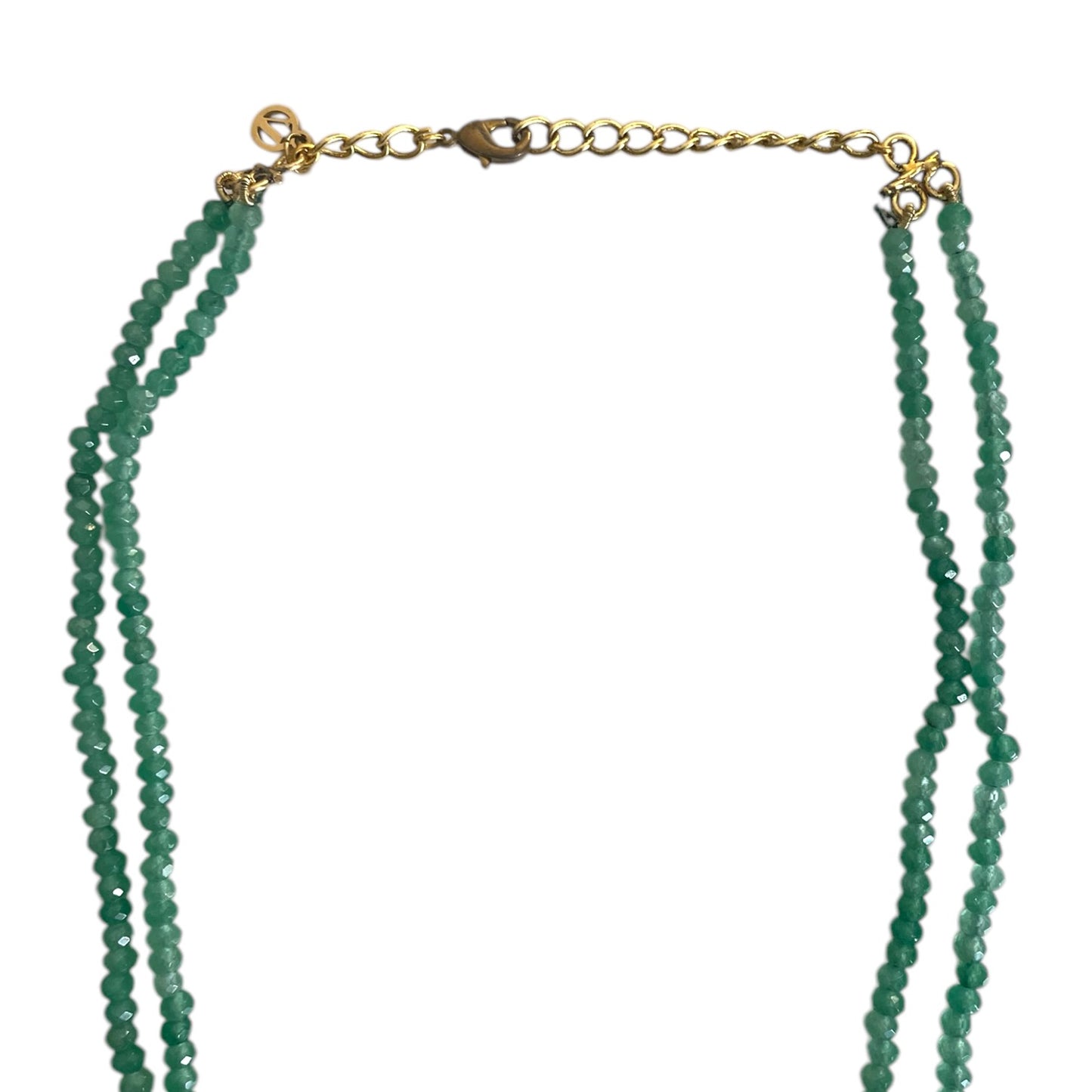 Introducing the Rose Necklace, a stunning homage to Édith Piaf’s timeless love song La vie en rose, where elegance meets artistic expression. This luxurious long necklace features a striking rectangular pendant adorned with kundan stones and gold accents, evoking a sense of romantic sophistication and Parisian charm. The pendant’s unique design, with a delicate drop bead, adds fluidity and grace, symbolizing the endless beauty of love. The rich green jade represents vitality and renewal, while the radiant 