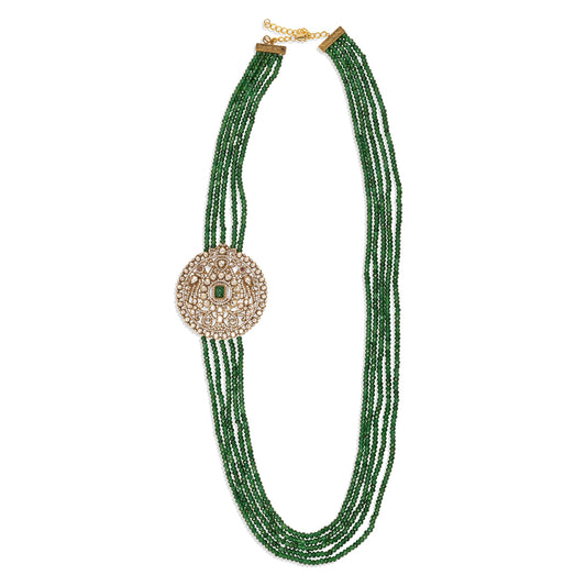 Green beaded necklace with a decorative clasp on a white background