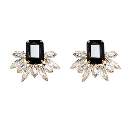 Pair of earrings with black gemstones and crystal-like accents on a white background