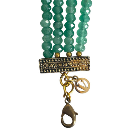 The Giovanna Bracelet is a luxurious tribute to Edith Piaf, named after her middle name, Giovanna. Handcrafted with four strands of jade beads on each side, this elegant bracelet features a rectangular center adorned with vibrant red, green, and white stones—each chosen for their symbolic meaning and energy. 