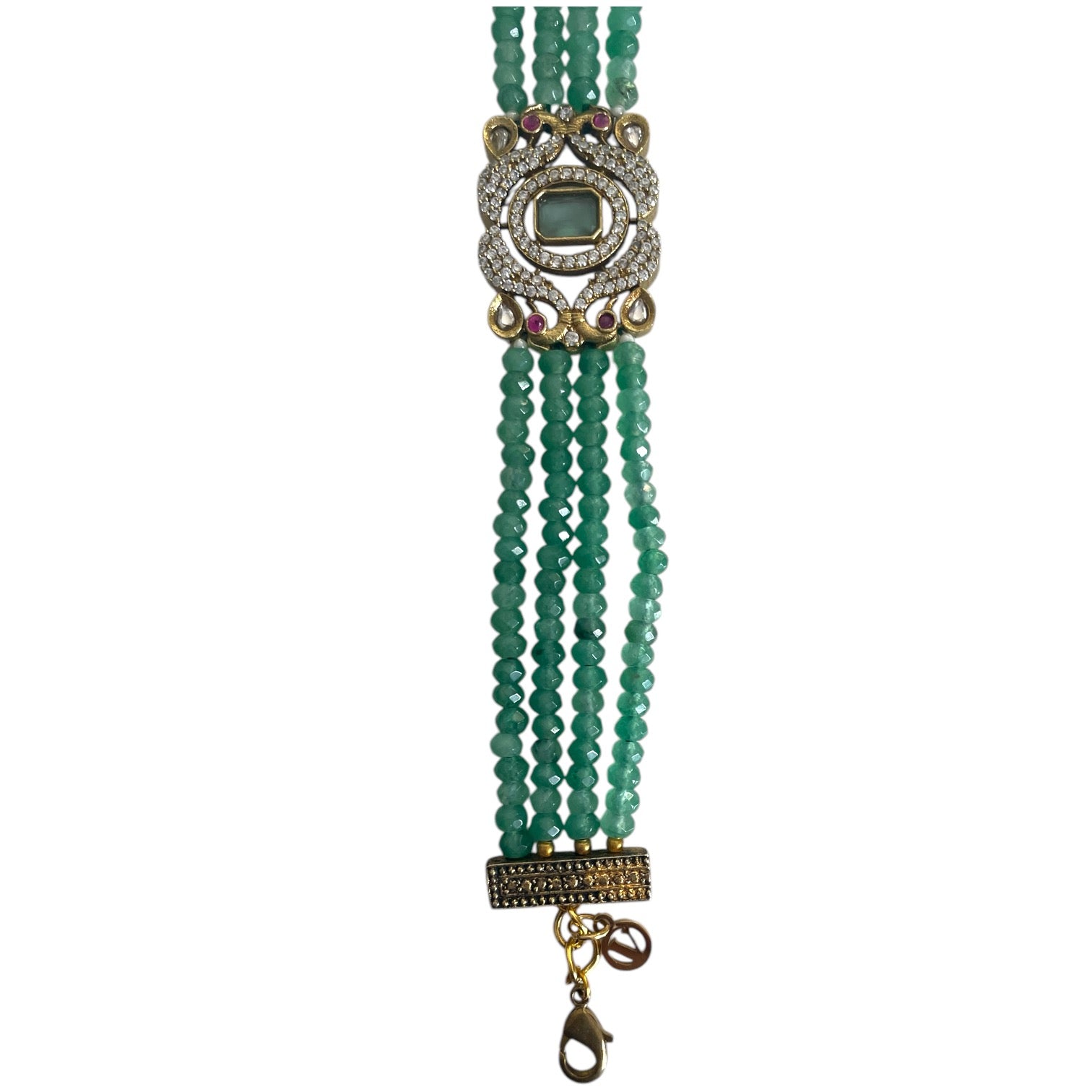 The Giovanna Bracelet is a luxurious tribute to Edith Piaf, named after her middle name, Giovanna. Handcrafted with four strands of jade beads on each side, this elegant bracelet features a rectangular center adorned with vibrant red, green, and white stones—each chosen for their symbolic meaning and energy. 
