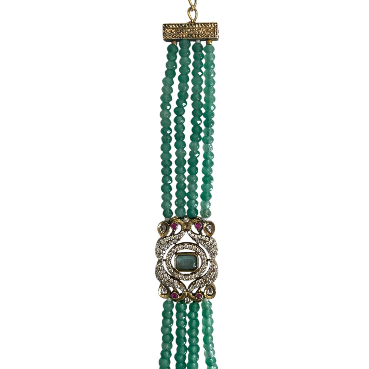 The Giovanna Bracelet is a luxurious tribute to Edith Piaf, named after her middle name, Giovanna. Handcrafted with four strands of jade beads on each side, this elegant bracelet features a rectangular center adorned with vibrant red, green, and white stones—each chosen for their symbolic meaning and energy. 