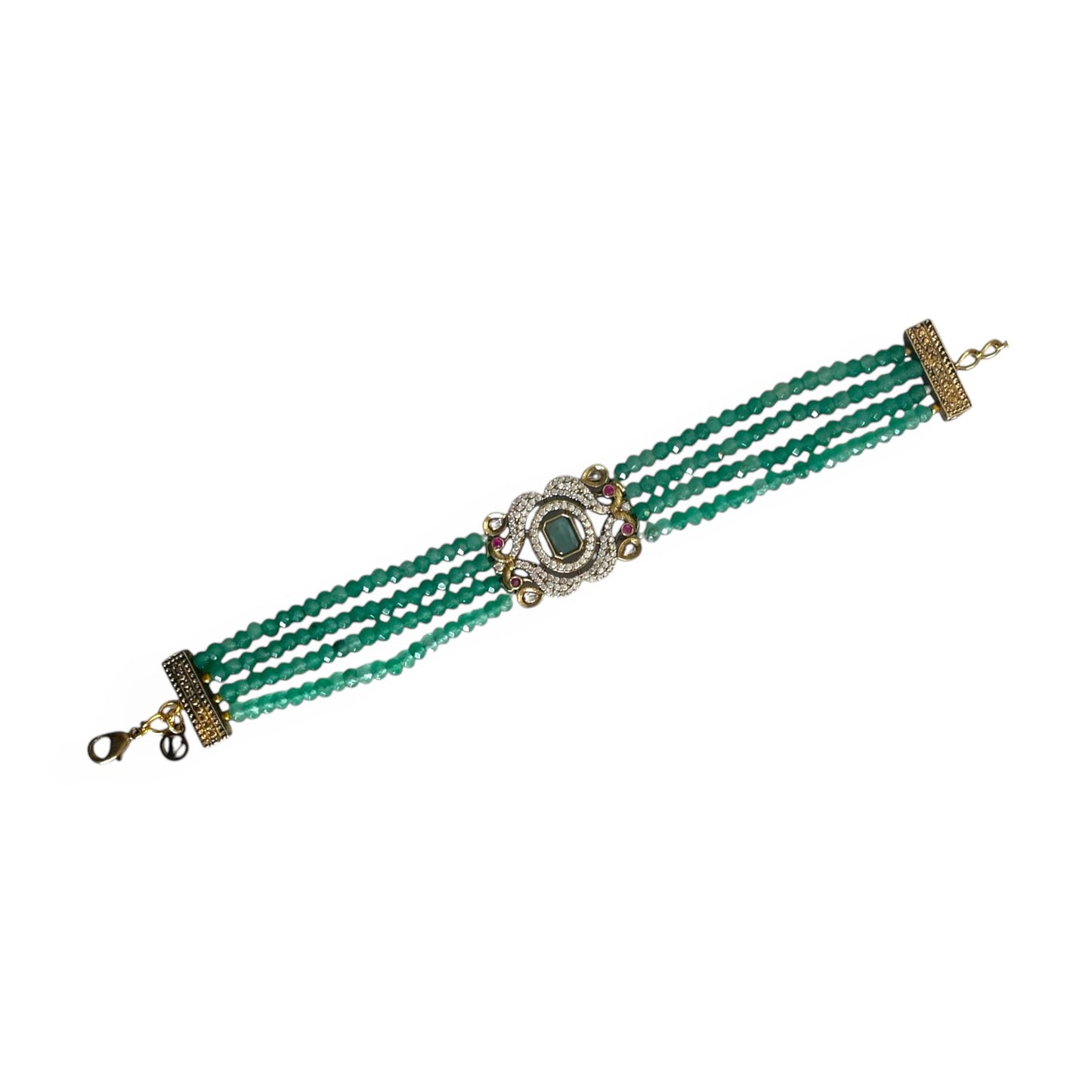 The Giovanna Bracelet is a luxurious tribute to Edith Piaf, named after her middle name, Giovanna. Handcrafted with four strands of jade beads on each side, this elegant bracelet features a rectangular center adorned with vibrant red, green, and white stones—each chosen for their symbolic meaning and energy.