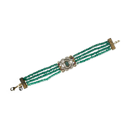 The Giovanna Bracelet is a luxurious tribute to Edith Piaf, named after her middle name, Giovanna. Handcrafted with four strands of jade beads on each side, this elegant bracelet features a rectangular center adorned with vibrant red, green, and white stones—each chosen for their symbolic meaning and energy.