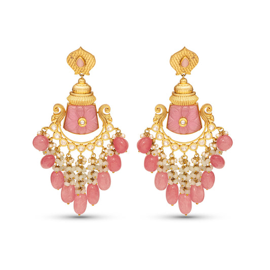Pair of pink and gold earrings on a white background