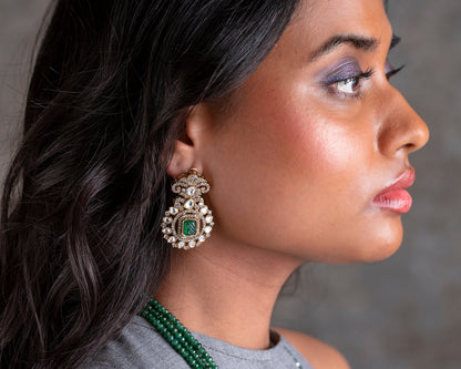 Close-up of a woman wearing a decorative earring with a blurred background