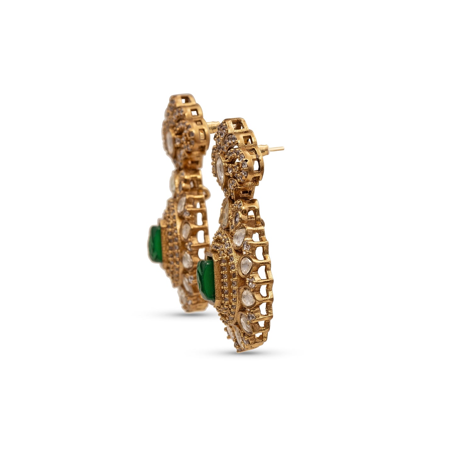 Gold earrings with green accents on a white background