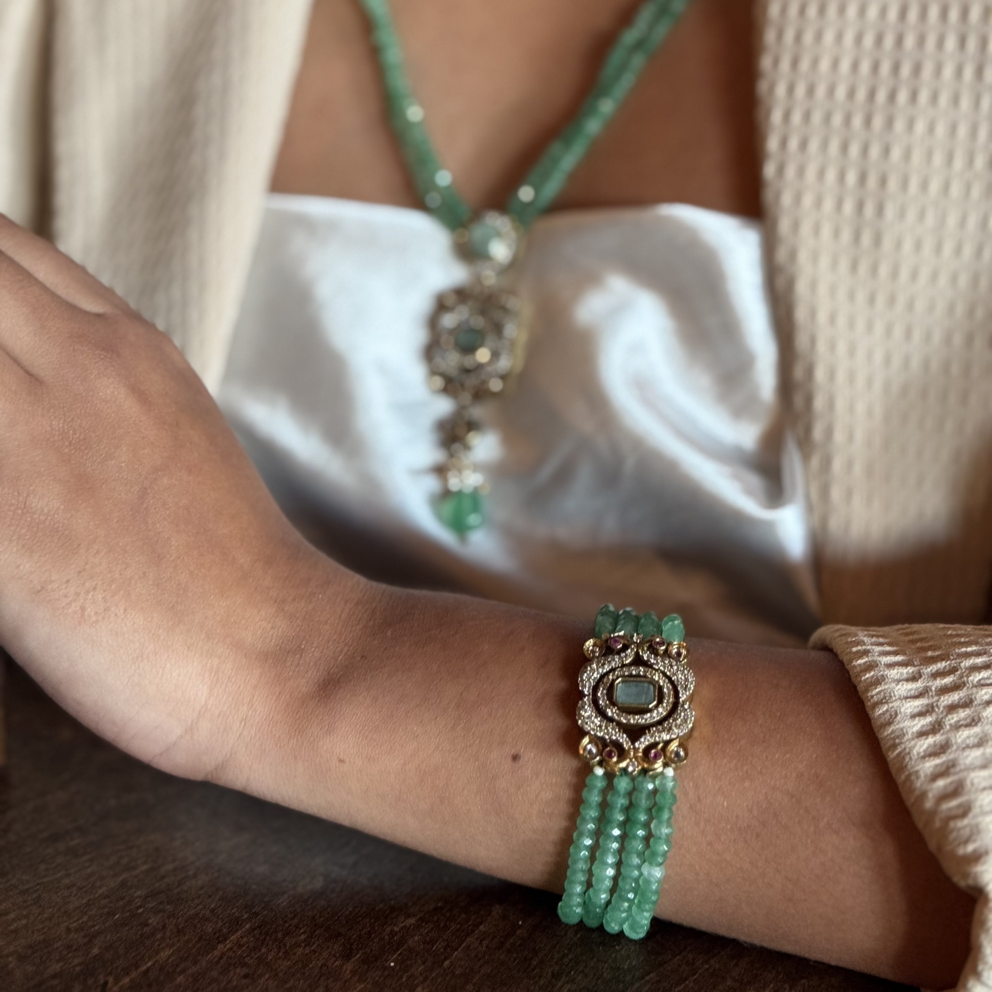 The Giovanna Bracelet is a luxurious tribute to Edith Piaf, named after her middle name, Giovanna. Handcrafted with four strands of jade beads on each side, this elegant bracelet features a rectangular center adorned with vibrant red, green, and white stones—each chosen for their symbolic meaning and energy. 