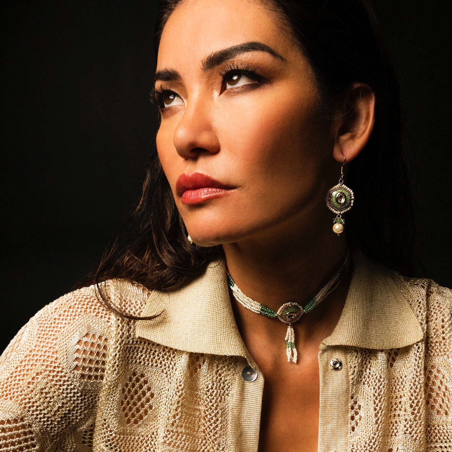 These earrings embody the free-spirited elegance and musical beauty of classic jazz. The Gypsy Earrings feature a striking hexagonal shape, with lustrous pearls dangling gracefully beneath, creating movement and light. Hand-painted green enamel adds a pop of color