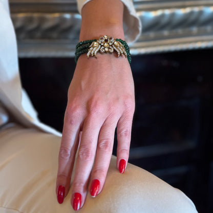 Introducing the Rita Bracelet, a stunning fusion of avant-garde elegance and Parisian flair. Inspired by the bold, rebellious spirit of the iconic French duo Les Rita Mitsouko, this bracelet features luminous jade beads and sparkling Kundan stones in a captivating green and gold palette with a hint of red. Designed to evoke the graceful, powerful movement of wings, it captures the essence of freedom, creativity, and unforgettable style.
