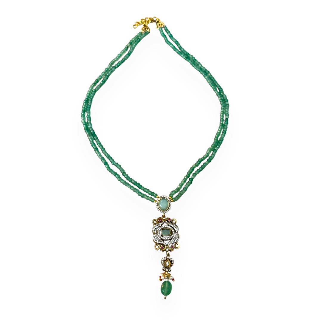 Rose Necklace, a stunning homage to Édith Piaf’s timeless love song La vie en rose, where elegance meets artistic expression. This luxurious long necklace features a striking rectangular pendant adorned with kundan stones and gold accents, evoking a sense of romantic sophistication and Parisian charm. 