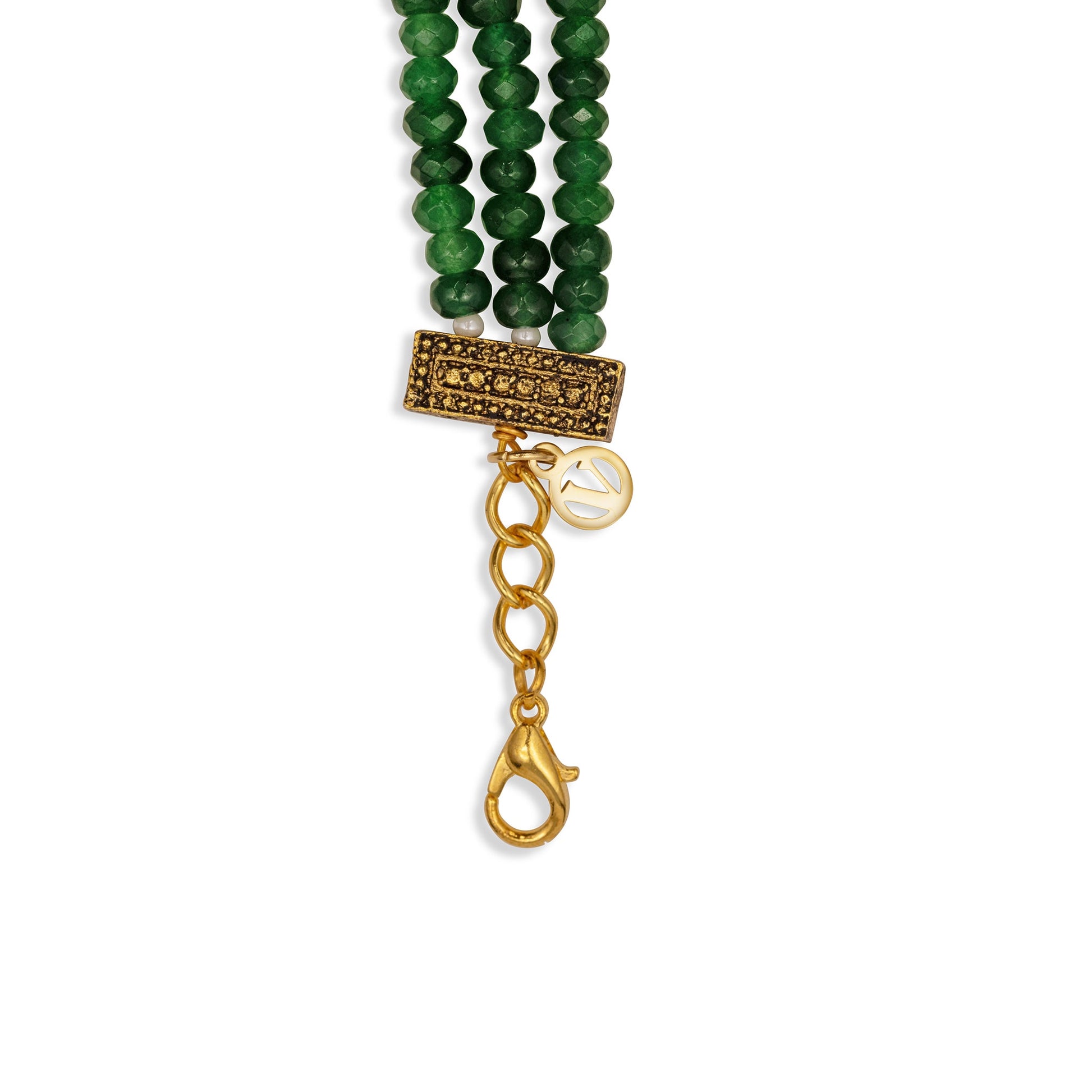 Green beaded bracelet with gold clasp on a white background