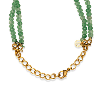 Green beaded necklace with gold chain on a white background
