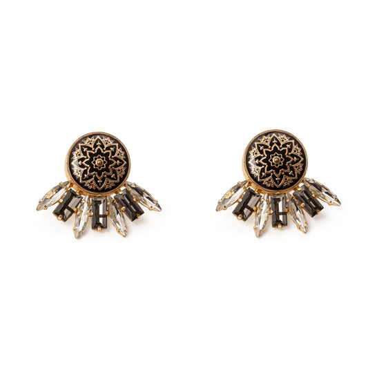 Pair of ornate earrings with intricate designs on a white background