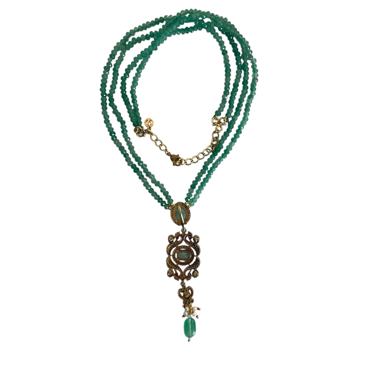 Introducing the Rose Necklace, a stunning homage to Édith Piaf’s timeless love song La vie en rose, where elegance meets artistic expression. This luxurious long necklace features a striking rectangular pendant adorned with kundan stones and gold accents, evoking a sense of romantic sophistication and Parisian charm. The pendant’s unique design, with a delicate drop bead, adds fluidity and grace, symbolizing the endless beauty of love. The rich green jade represents vitality and renewal, while the radiant g