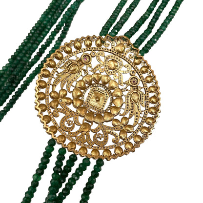 Introducing the Édith Necklace, a captivating fusion of elegance and bold artistry, named in honor of the iconic Édith Piaf. This luxurious necklace features a round pendant crafted with a stunning green jade stone necklace, framed in 18k gold dipped vintage elegance to evoke timeless Parisian glamour. Worn off-center, like an elegant brooch, the pendant creates a striking, asymmetrical silhouette that drapes with effortless grace, offering a fresh twist on classic jewelry. 