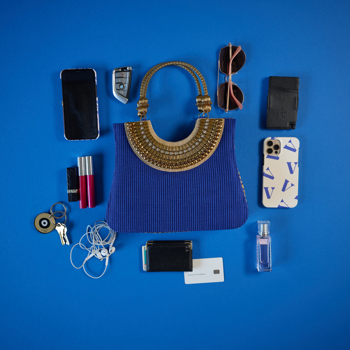 Suriya Mini tote blue and gold with ornate handles. As seen on ramp at NYFW 2021 and editorials. Almost everything fits. Sunglasses, Phone, card holders,  make-up, keys, perfume
